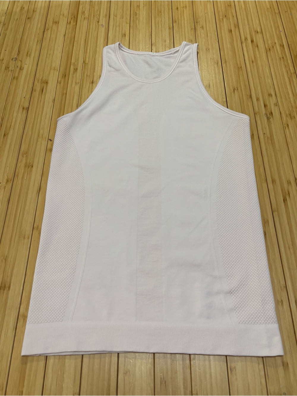 Lululemon light pink tank top. No tag. Measures a small.